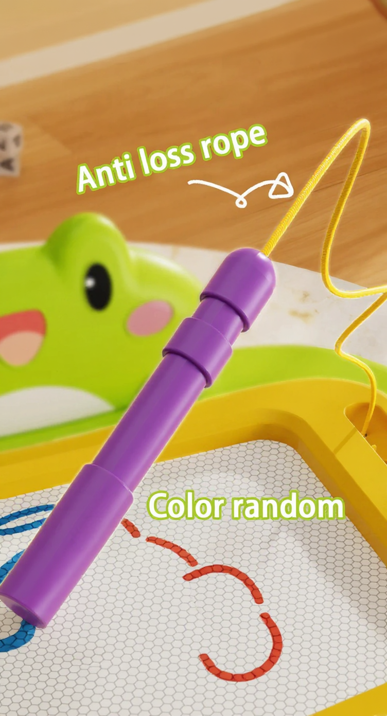 Purple anti-loss rope with a green frog toy in the background on a wooden surface.